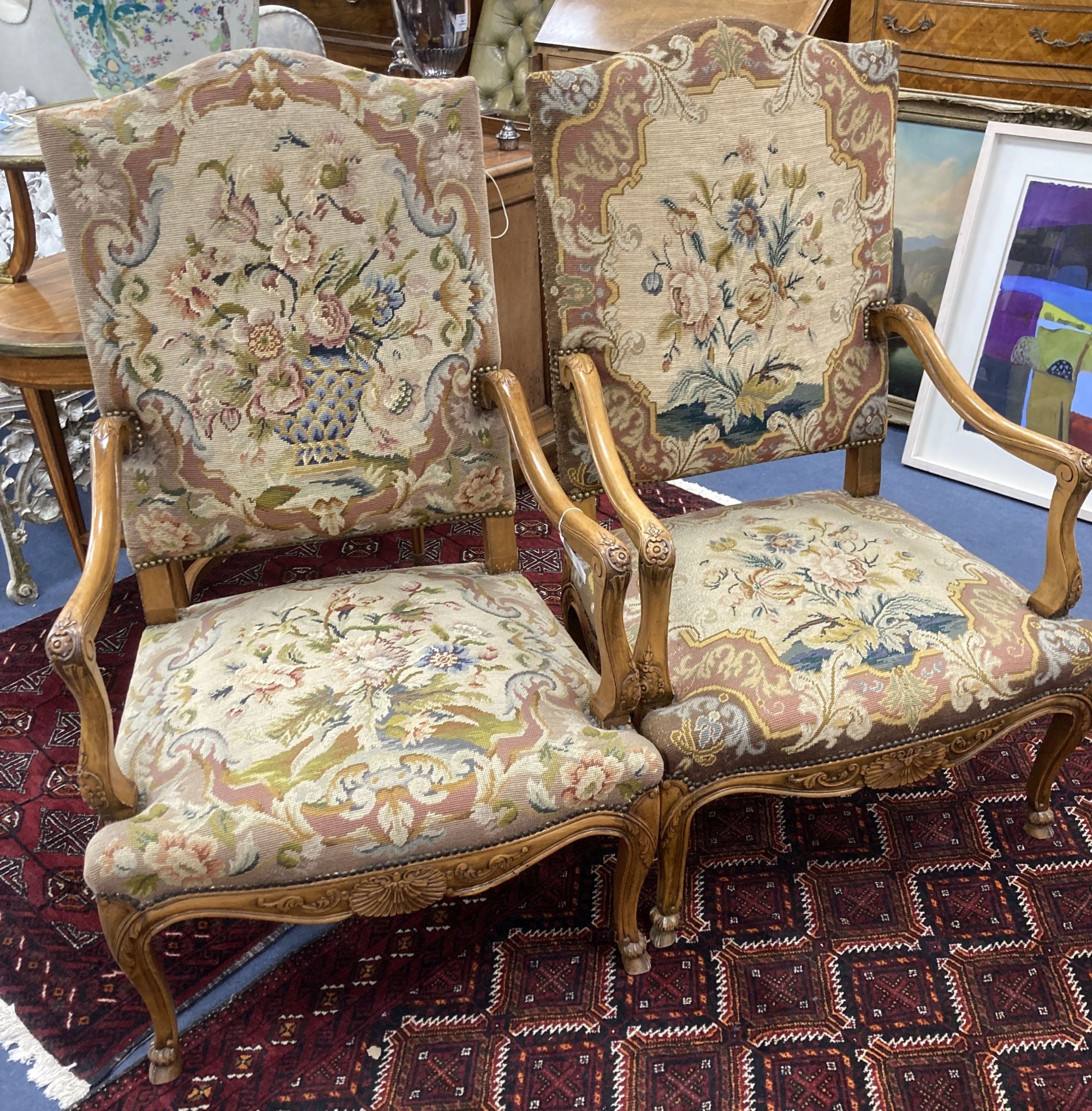 A pair of Louis XV style needlepoint armchairs, width 69cm, depth 60cm, height 110cm